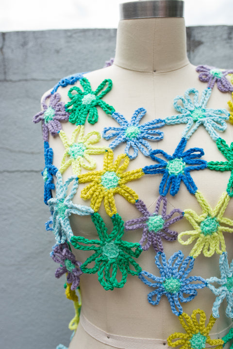 Blue, yellow, and green crocheted flower dress.
