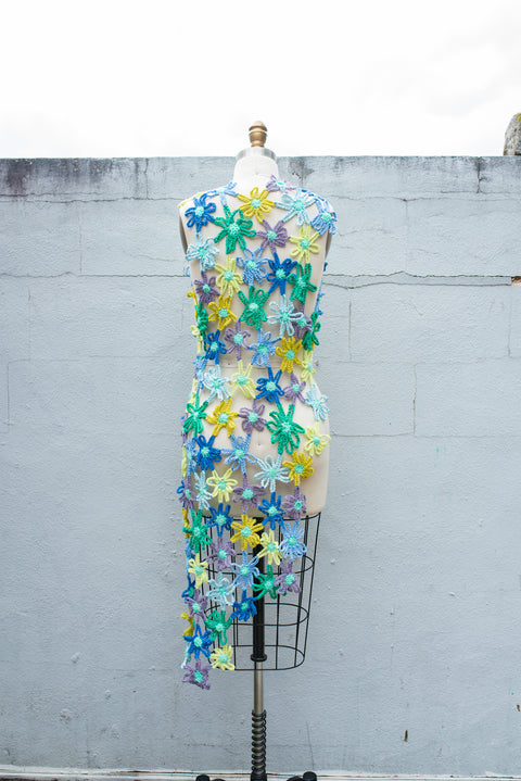 Blue, yellow, and green crocheted flower dress.