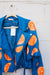 Blue leather jacket with hand-painted oranges.