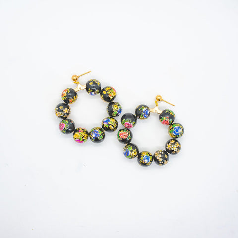 Beaded hoop earrings with flower print.
