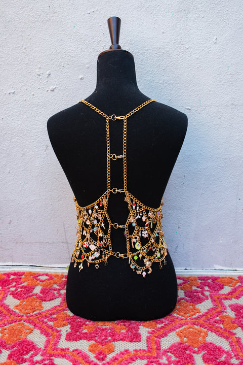 Gold chain top covered in hundreds of enamel charms.