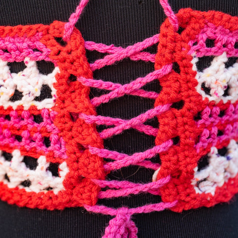 Pink and red crocheted halter top.