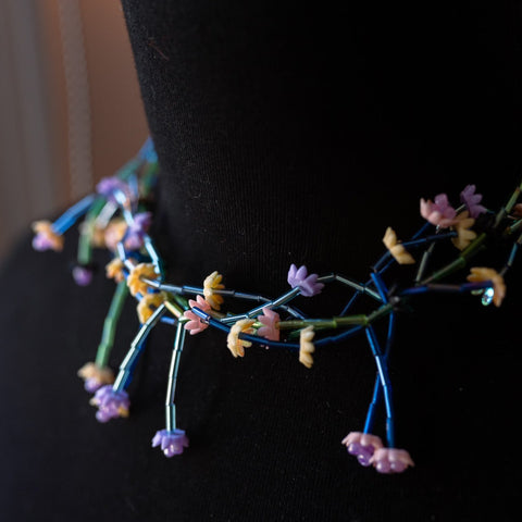Multicolor hand-beaded flower statement necklace.