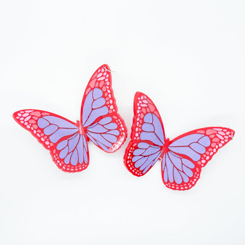 Red butterfly earrings.