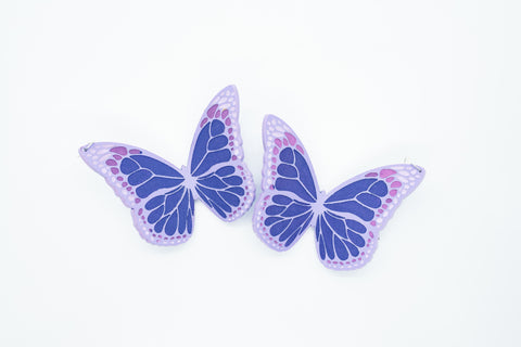 Purple butterfly earrings.