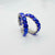 Blue jeweled hoop earrings.
