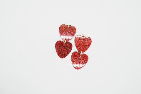 Red glitter heart earrings by Smells Like Crime, Co.
