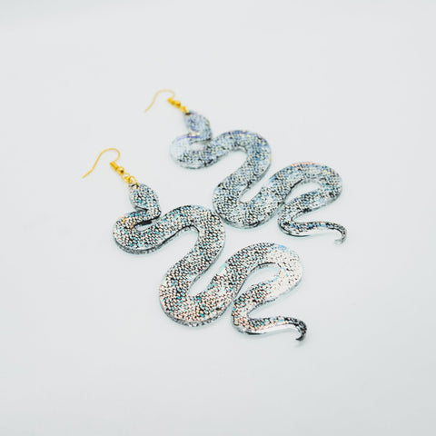 Iridescent snake earrings by Smells Like Crime, Co.