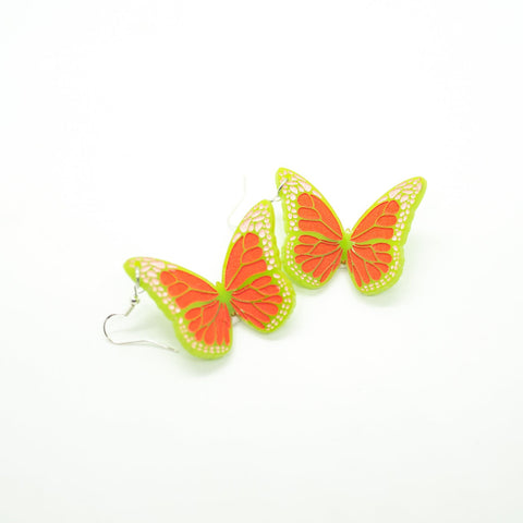 Green and orange butterfly earrings by Smells Like Crime, Co.